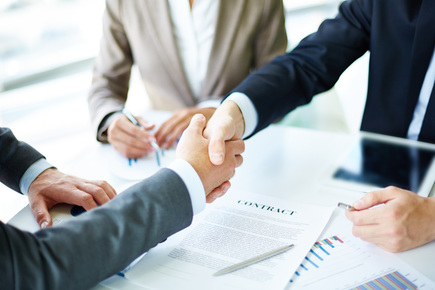 Gentle hand-shaken between two businessmen while signing the logistics contract